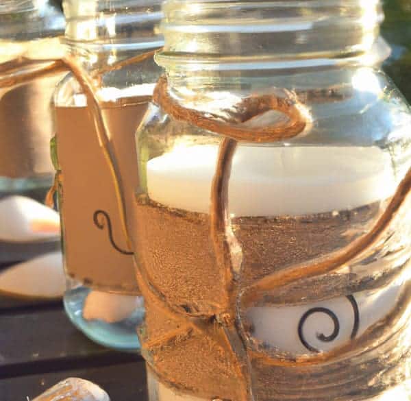 https://beachfrontdecor.com/wp-content/uploads/2023/03/coastal-candle-wedding-favors-with-mason-jars.jpg